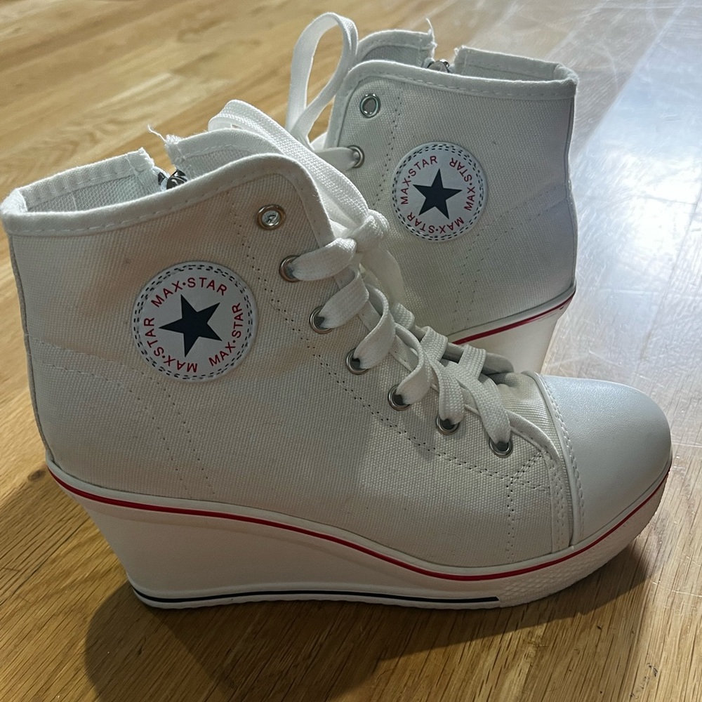 Size 7.5 Converse high tops with a little wedge!